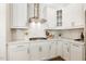 Charming kitchen with white cabinets, subway tile backsplash, and modern appliances, offering a clean and stylish space at 405 Daisy Grove Ln, Holly Springs, NC 27540