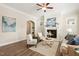 Comfortable living room featuring a fireplace, neutral tones, and stylish decor for a relaxing ambiance at 405 Daisy Grove Ln, Holly Springs, NC 27540