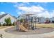 Community playground with colorful play structures, perfect for Gathering fun and activity at 405 Daisy Grove Ln, Holly Springs, NC 27540