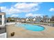 Large community pool surrounded by houses, offering a relaxing oasis for residents at 405 Daisy Grove Ln, Holly Springs, NC 27540