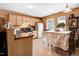Cozy kitchen with natural wood cabinets and dining area, perfect for Gathering meals at 4118 Sudbury Rd, Durham, NC 27704
