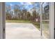 View of backyard from open door, shed on lot, and patio for outdoor entertaining at 4509 Alamance Baptist Church Loop, Burlington, NC 27215