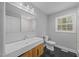 Bright bathroom featuring a modern sink, vanity, and fixtures, alongside a marble tiled shower at 4509 Alamance Baptist Church Loop, Burlington, NC 27215