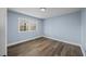 Bright bedroom featuring wood floors, large windows, and ample natural light at 4509 Alamance Baptist Church Loop, Burlington, NC 27215