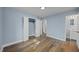 Spacious bedroom featuring hardwood floors, closet, and an ensuite bathroom at 4509 Alamance Baptist Church Loop, Burlington, NC 27215