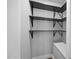 Walk in closet featuring built in shelving and ample storage space at 4509 Alamance Baptist Church Loop, Burlington, NC 27215