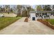 Long driveway leading to a home with brick accents and landscaping at 4509 Alamance Baptist Church Loop, Burlington, NC 27215
