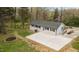 Charming home featuring a modern exterior with a new patio and a well-maintained yard at 4509 Alamance Baptist Church Loop, Burlington, NC 27215