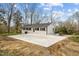 Exterior of home with large patio and mature trees at 4509 Alamance Baptist Church Loop, Burlington, NC 27215