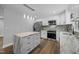 Modern kitchen featuring stainless steel appliances, island, and stone countertops at 4509 Alamance Baptist Church Loop, Burlington, NC 27215