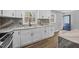 Beautiful kitchen featuring white cabinets, granite countertops, and stainless steel faucet at 4509 Alamance Baptist Church Loop, Burlington, NC 27215