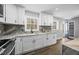 Beautiful kitchen featuring white cabinets, granite countertops, and stainless steel faucet at 4509 Alamance Baptist Church Loop, Burlington, NC 27215