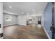 Spacious open-concept living room with luxury vinyl plank flooring and neutral paint colors at 4509 Alamance Baptist Church Loop, Burlington, NC 27215