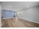 Bright and airy living room with luxury vinyl plank flooring and fresh paint at 4509 Alamance Baptist Church Loop, Burlington, NC 27215