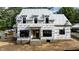 New construction home featuring a modern design with large windows and brick foundation is being built at 5107 Hearth Dr, Raleigh, NC 27609