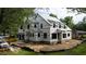 Exterior view of new house construction featuring a modern design, brick foundation and large windows at 5107 Hearth Dr, Raleigh, NC 27609