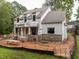 New construction two-story home with a brick base and ladder access points on a muddy lot at 5107 Hearth Dr, Raleigh, NC 27609