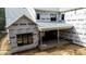 Back elevation view featuring covered patio and brick foundation in home under construction at 5107 Hearth Dr, Raleigh, NC 27609