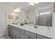 Modern bathroom featuring a double sink vanity, marble countertops, and walk-in shower at 5205 Sorrell Glen Dr, Raleigh, NC 27603