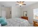 Bright bedroom with a ceiling fan, natural light from the window, and classic furnishings at 5205 Sorrell Glen Dr, Raleigh, NC 27603