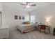 Charming bedroom with a full-sized bed, decorative artwork, and a ceiling fan at 5205 Sorrell Glen Dr, Raleigh, NC 27603