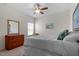 Bright bedroom with dresser, large window, and decorative touches at 5205 Sorrell Glen Dr, Raleigh, NC 27603