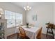 Bright dining area with modern decor, hardwood floors, and large window at 5205 Sorrell Glen Dr, Raleigh, NC 27603