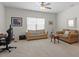 Inviting living room with a seating area, ceiling fan, and a large window at 5205 Sorrell Glen Dr, Raleigh, NC 27603