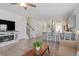 Open-concept living area showcasing hardwood floors and a cozy fireplace at 5205 Sorrell Glen Dr, Raleigh, NC 27603