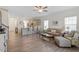 Spacious living room featuring an open-concept kitchen and natural light at 5205 Sorrell Glen Dr, Raleigh, NC 27603