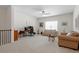 Spacious living room with neutral walls, ceiling fan, and a comfortable seating area at 5205 Sorrell Glen Dr, Raleigh, NC 27603