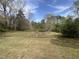 View of pond visible through backyard fence at 5486 B Us Hwy 301, Four Oaks, NC 27524