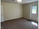Bright bedroom featuring neutral walls and plush carpeting, perfect for relaxation at 5486 B Us Hwy 301, Four Oaks, NC 27524