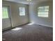 Cozy bedroom with natural light streaming through the windows, creating a warm atmosphere at 5486 B Us Hwy 301, Four Oaks, NC 27524