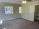 Comfortable bedroom featuring neutral decor and plush carpeting, creating a peaceful retreat at 5486 B Us Hwy 301, Four Oaks, NC 27524