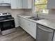 Updated kitchen features granite counters, stainless appliances and ample cabinet space at 5486 B Us Hwy 301, Four Oaks, NC 27524