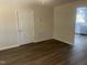 Living room with new floors and views to the kitchen at 5486 B Us Hwy 301, Four Oaks, NC 27524