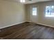 Spacious room with new floors, natural light, and an exterior door at 5486 B Us Hwy 301, Four Oaks, NC 27524