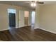 Living room with new floors, ceiling fan, and views to other rooms at 5486 B Us Hwy 301, Four Oaks, NC 27524