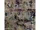 Aerial view of a neighborhood with multiple homes, including a property with a tennis court at 55 Lindsey St, Pittsboro, NC 27312