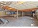 Unfinished basement with concrete floor and ceiling; potential for storage or future expansion at 55 Lindsey St, Pittsboro, NC 27312