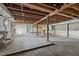 Spacious unfinished basement with exposed ceiling beams and concrete flooring at 55 Lindsey St, Pittsboro, NC 27312