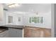 Bright living room featuring windows and a ceiling fan at 55 Lindsey St, Pittsboro, NC 27312