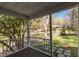Covered porch with view to the front yard and street offers a relaxing outdoor space at 55 Lindsey St, Pittsboro, NC 27312