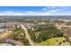 Expansive aerial view of a well-planned community with lush green spaces and modern homes at 715 White Oak Pond Rd, Apex, NC 27523