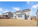 Spacious backyard featuring a manicured lawn, and house with solar panels and patio at 715 White Oak Pond Rd, Apex, NC 27523