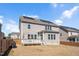 Backyard featuring a deck and lush lawn surrounded by wood fencing and a house with solar panels at 715 White Oak Pond Rd, Apex, NC 27523