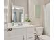 Bathroom with a white vanity, a mirror, and a shower with a patterned curtain at 715 White Oak Pond Rd, Apex, NC 27523