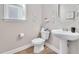 Powder room with a pedestal sink, decorative mirror, and neutral wall color at 715 White Oak Pond Rd, Apex, NC 27523