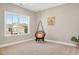 Bedroom featuring a unique hanging chair near a large window, with carpeted floors at 715 White Oak Pond Rd, Apex, NC 27523